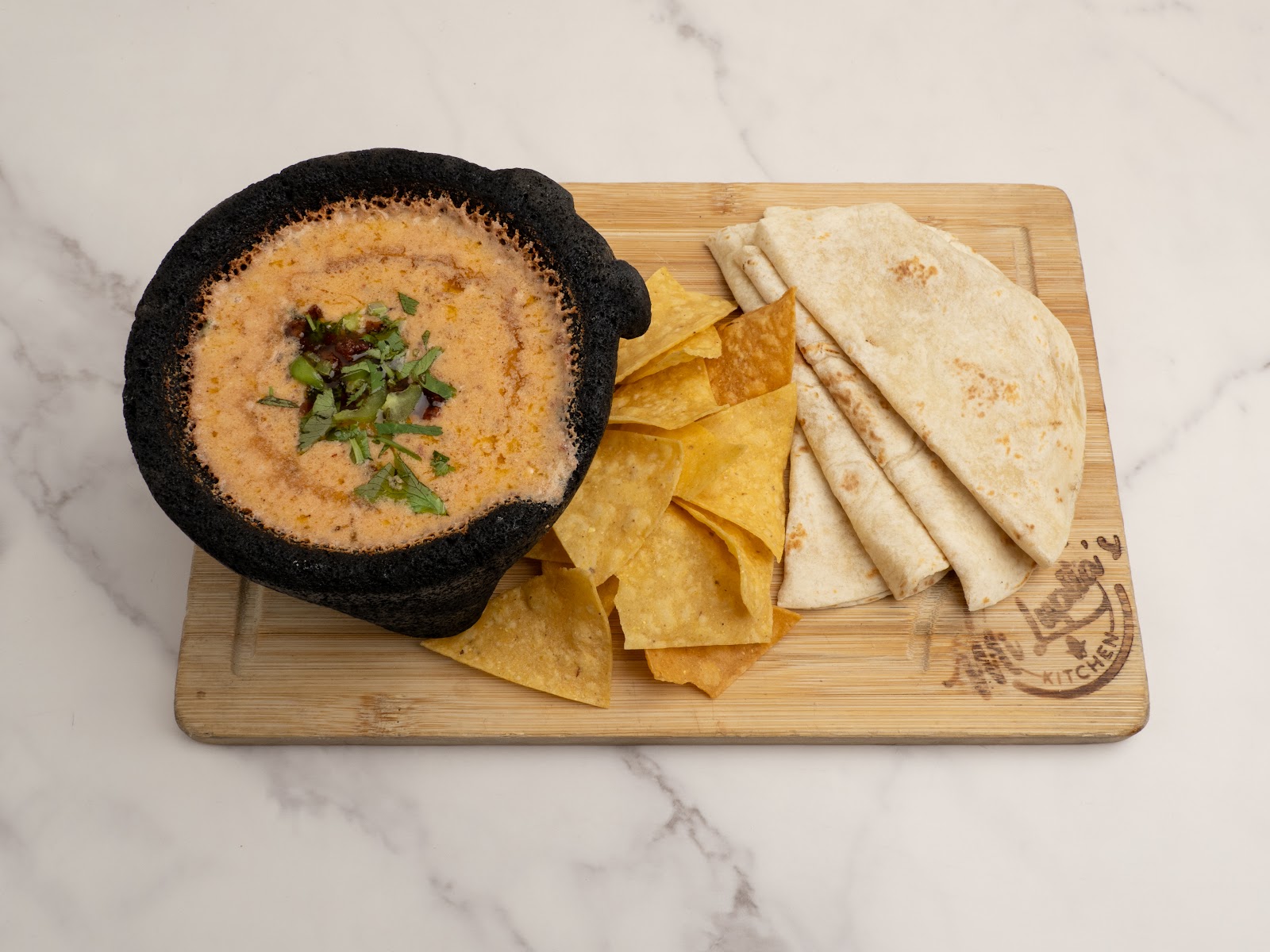 Choriqueso dip — melted cheese with house chorizo